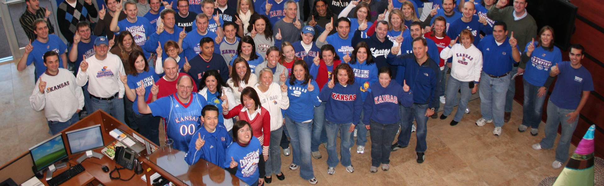 Perceptive Software company photo of KU alumni celebrating the NCAA championship win.